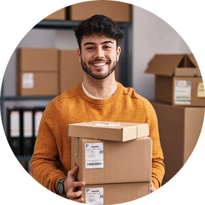 person holding shipping boxes