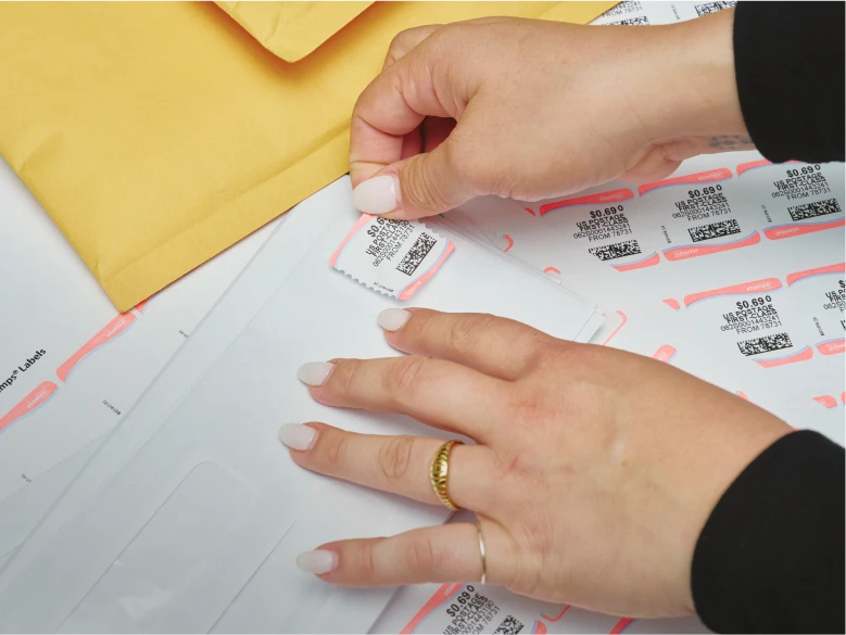 Applying a printed stamp to an envelope